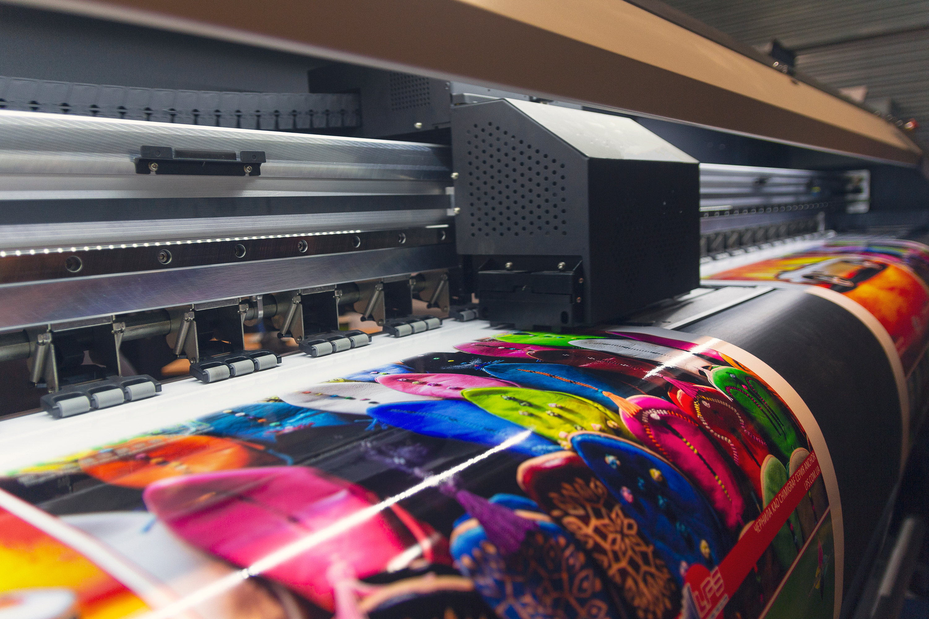 A printer producing high-quality, color digital prints on glossy paper.